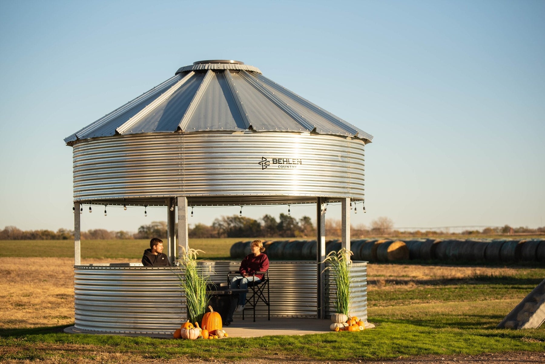 Behlen Country BinVista grain bin gazebo installed in a backyard, compared against the Sioux Steel grain bin gazebo