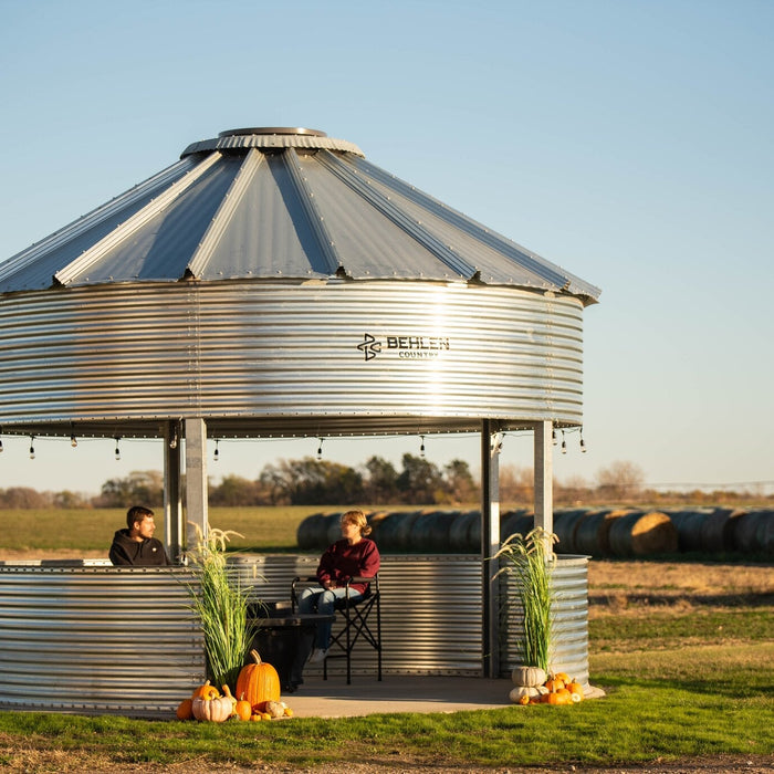 Behlen Country BinVista grain bin gazebo installed in a backyard, compared against the Sioux Steel grain bin gazebo