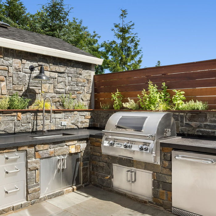 brick and steel outdoor kitchen set up
