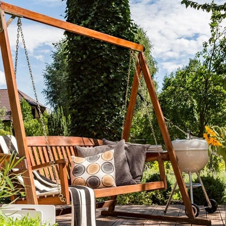 image of a swing with cushion at a patio