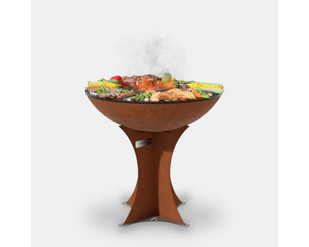 Arteflame Classic 30" Corten Steel Grill with Tall Euro Base grilling meat, chicken, and vegetables on flat-top surface