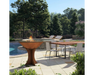 Arteflame Classic 40" Corten Steel Grill with Tall Euro Base on outdoor poolside patio with dining table setting
