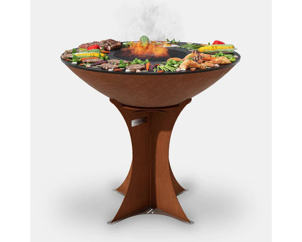 Arteflame Classic 40" Corten Steel Grill with Tall Euro Base grilling steaks, chicken, and vegetables on flat-top surface
