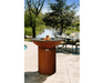 Arteflame Classic 40" Corten Steel Grill with Tall Round Base on outdoor patio by pool and lakeside dining setting