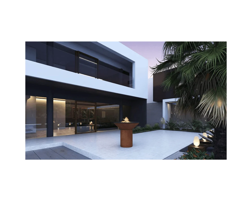 Arteflame Classic 40" Corten Steel Grill with Tall Round Base in modern luxury outdoor courtyard patio at dusk