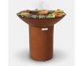 Arteflame Classic 40" Corten Steel Grill with Tall Round Base grilling steaks, chicken, and vegetables on flat-top surface