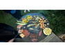 Arteflame Grill Grate Insert overhead view with corn, sausages, steaks, and mixed vegetables on flat-top steel surface