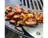 Arteflame Griddle Scraper cleaning sautéed mushrooms off Arteflame carbon steel flat-top grill cooktop surface