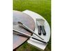 Arteflame Stainless Steel Side Warming Table shelf holding grill tongs and spatula beside Arteflame corten steel cooktop