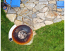 Arteflame Stainless Steel Side Warming Table shelf attached to Arteflame Grill overhead view on stone patio in backyard