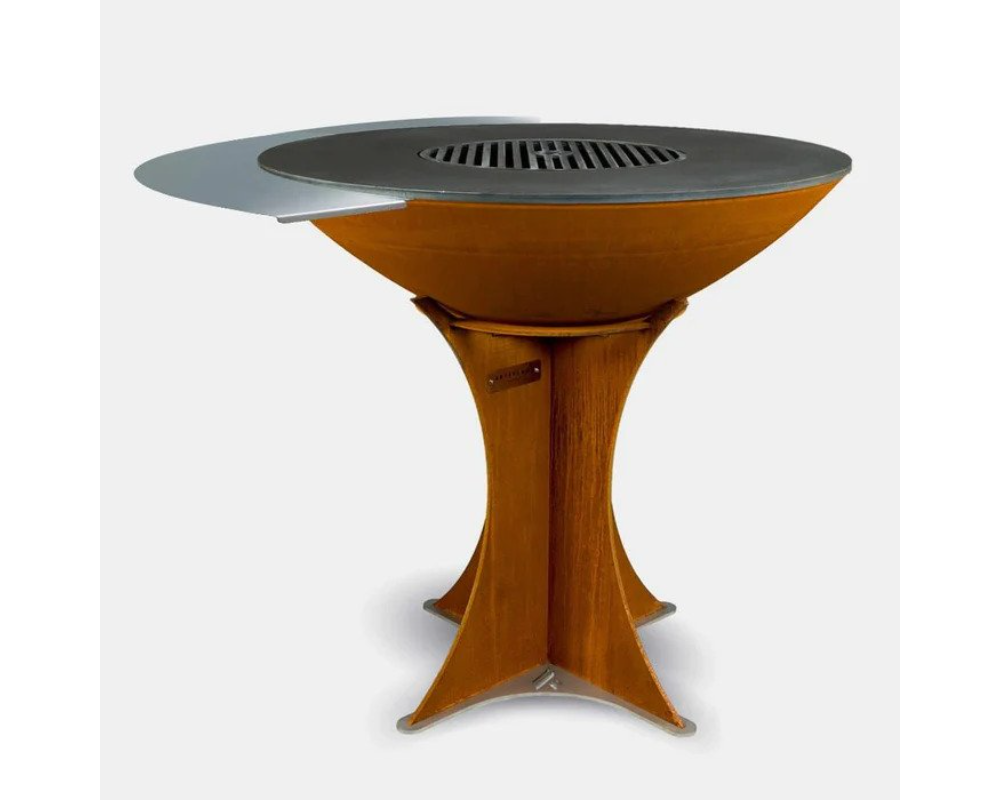 Arteflame outdoor grill with flat steel cooktop, side shelf, center grate, and hourglass corten steel pedestal base