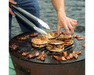 Arteflame One Series 20" Grill flat-top steel surface cooking meat-filled tacos and chorizo with stainless steel tongs