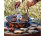 Arteflame One Series 30" Grill cooking burger patties and bread on flat-top steel surface with Arteflame spatulas over flame