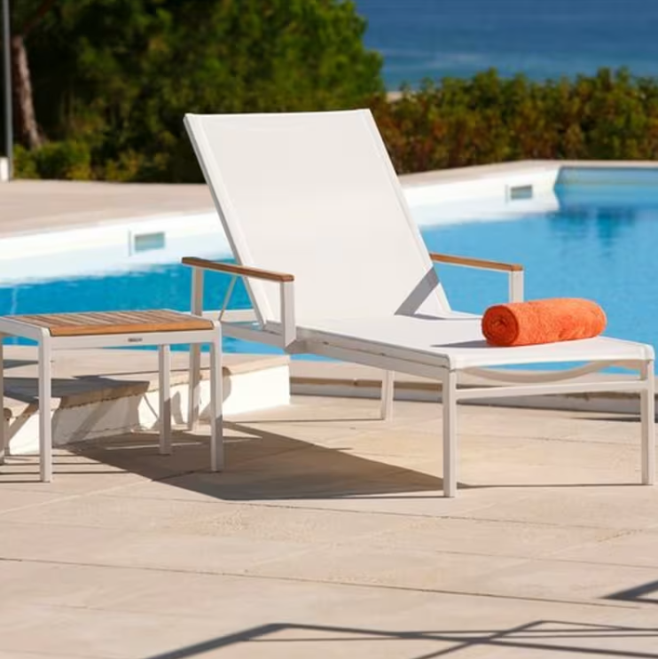 Barlow Tyrie Aura sling chaise lounge arctic white frame pearl sling pool deck outdoor lifestyle side table
