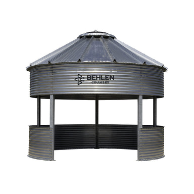 Metal grain storage silo with Behlen Country logo on a white background