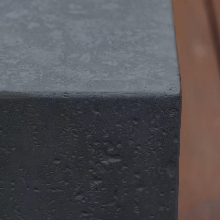 Elementi Metropolis fire pit table GFRC concrete corner texture closeup in dark gray
