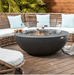 Elementi Lunar Bowl 42" round concrete fire pit on outdoor deck with glass wind screen