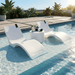 Floating Luxuries Kai white polymer in-pool shelf chaise loungers and side table on pool tanning ledge