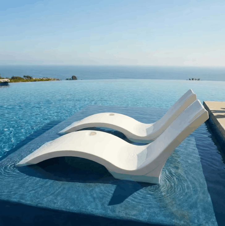 Image alt text: Floating Luxuries Kai pool shelf chaise lounge set of 2 white polymer infinity pool open ocean horizon luxury resort view