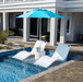 Floating Luxuries Kai pool shelf chaise lounge set of 2 white polymer tanning ledge with Kai side table umbrella champagne bucket STR backyard