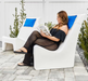Floating Luxuries Kai pool shelf chair white with blue pillow woman reading on patio lifestyle