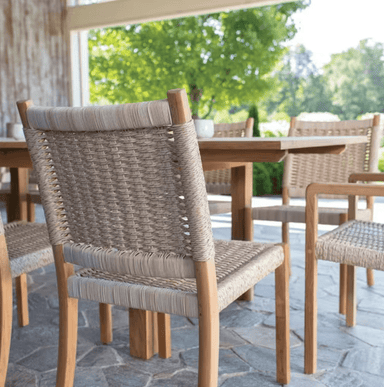 Kingsley Bate Hudson outdoor dining chair close-up showing teak frame and natural woven wicker back detail
