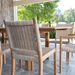 Kingsley Bate Hudson outdoor dining chair close-up showing teak frame and natural woven wicker back detail
