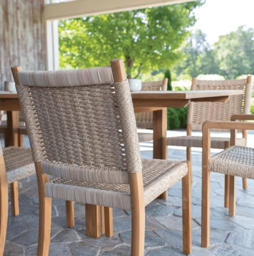 Kingsley Bate Hudson outdoor dining chair close-up showing teak frame and natural woven wicker back detail
