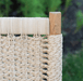 Kingsley Bate Hudson outdoor dining chair close-up of natural woven rope weave and teak frame joint detail

