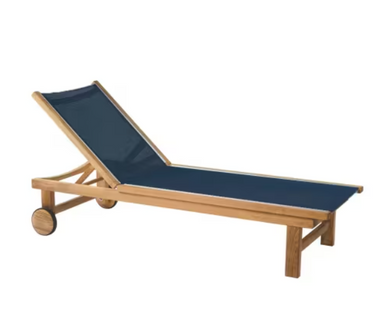 Kingsley Bate St. Tropez ST70 teak chaise lounge with navy blue sling, reclining back, and teak wheels
