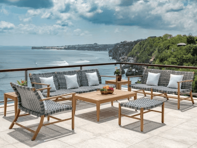 Kingsley Bate Tribeca Catherine 7-piece teak and wicker outdoor conversation set on oceanview terrace
