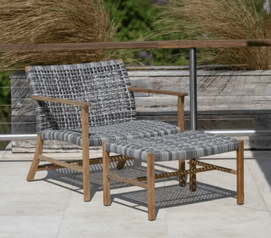 Kingsley Bate Catherine outdoor lounge chair and ottoman with teak frame and gray woven wicker on terrace