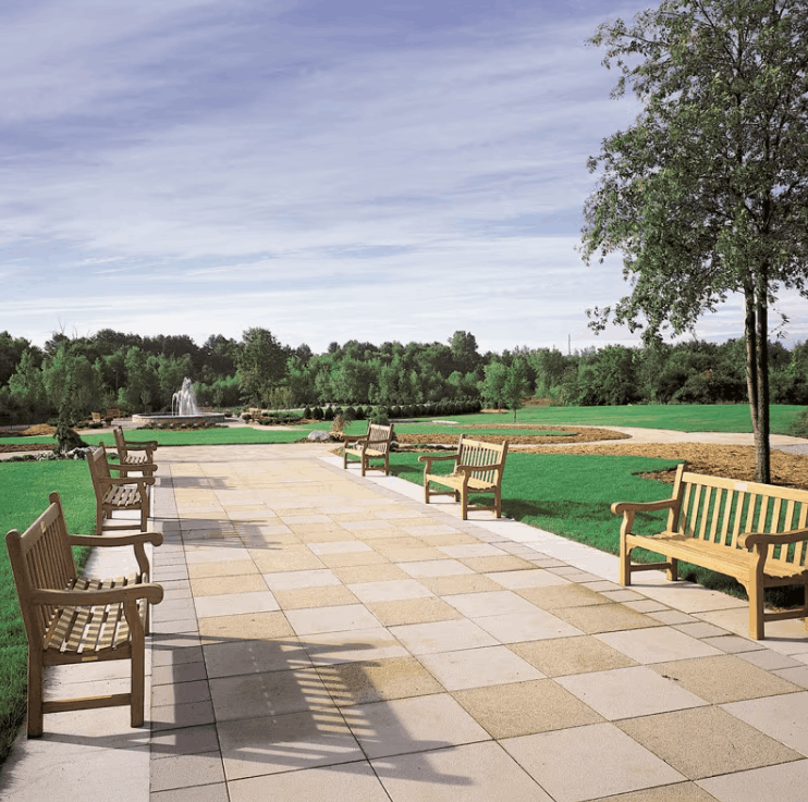 Multiple benches and armchairs on large commercial paved terrace with lawn and fountain
Kingsley Bate Hyde Park solid teak garden bench and armchair commercial paved terrace outdoor lawn