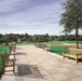 Multiple benches and armchairs on large commercial paved terrace with lawn and fountain
Kingsley Bate Hyde Park solid teak garden bench and armchair commercial paved terrace outdoor lawn