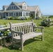 Bench weathered to silver-gray patina on coastal lawn with hydrangeas and shingle house
Kingsley Bate Hyde Park teak outdoor garden bench silver gray patina coastal lawn hydrangeas