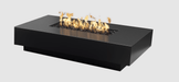 Modern black fire pit table with flames on a light gray background