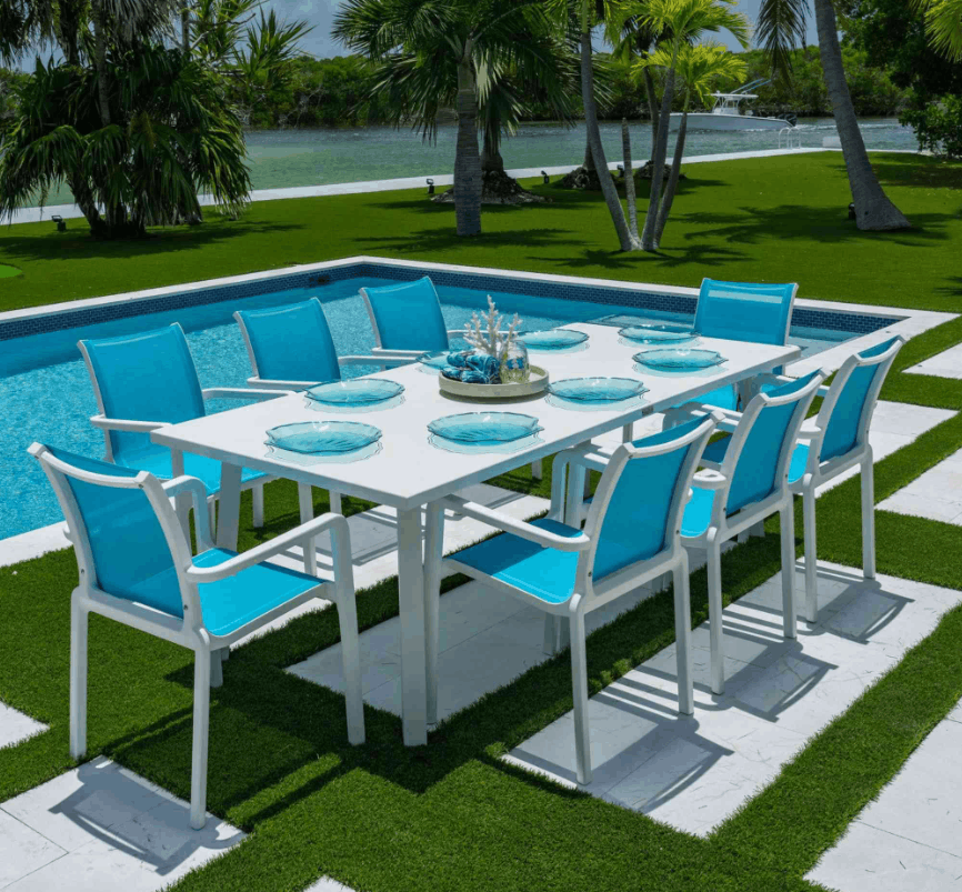 Panama Jack Abaco 9-Piece Outdoor Dining Set – Teal Sling Chairs