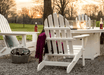 POLYWOOD Classic Folding Adirondack chairs ariund a fire pit table in an outdoor patio seating
