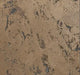 Textured brown surface with speckles of black and blue