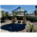 Sioux Steel grain bin gazebo with fire pit in a desert backyard — durable all-season outdoor structure for STR hosts