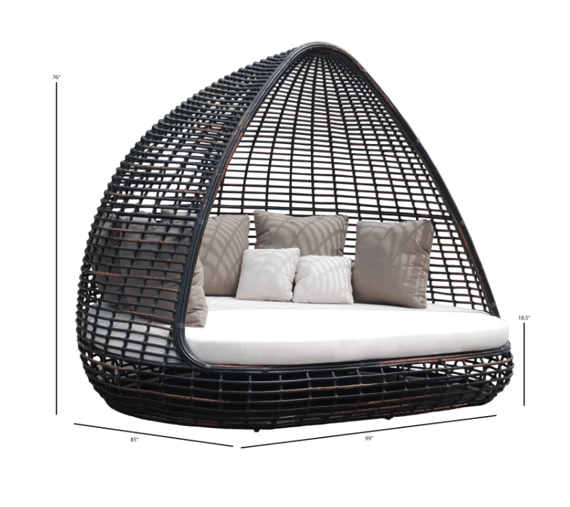 A dark woven egg-shaped outdoor daybed with a white cushion and gray patterned pillows, shown on a white background with height and width dimension lines and labels.
