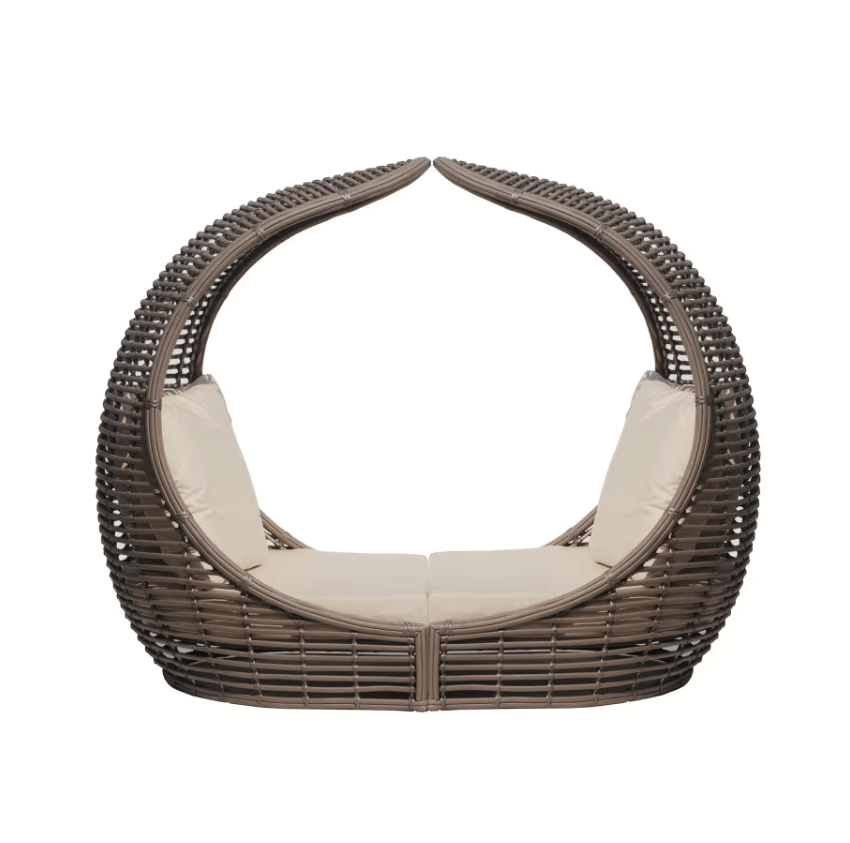 A modern wicker daybed with a curved, bubble-like silhouette, featuring a dark brown woven frame and light beige cushions, shown against a plain white background.