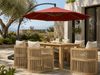 Panama Jack Cabo dining set shaded by an 11.5 foot terracotta cantilever umbrella on a patio