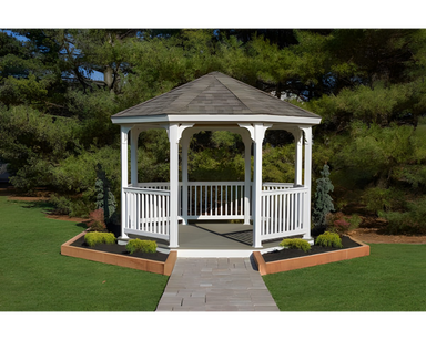 YardCraft 12ft vinyl octagon gazebo kit in backyard garden setting