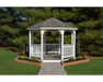 YardCraft 12ft vinyl octagon gazebo kit in backyard garden setting