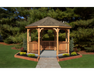 YardCraft 12ft wood octagon gazebo kit in backyard garden setting