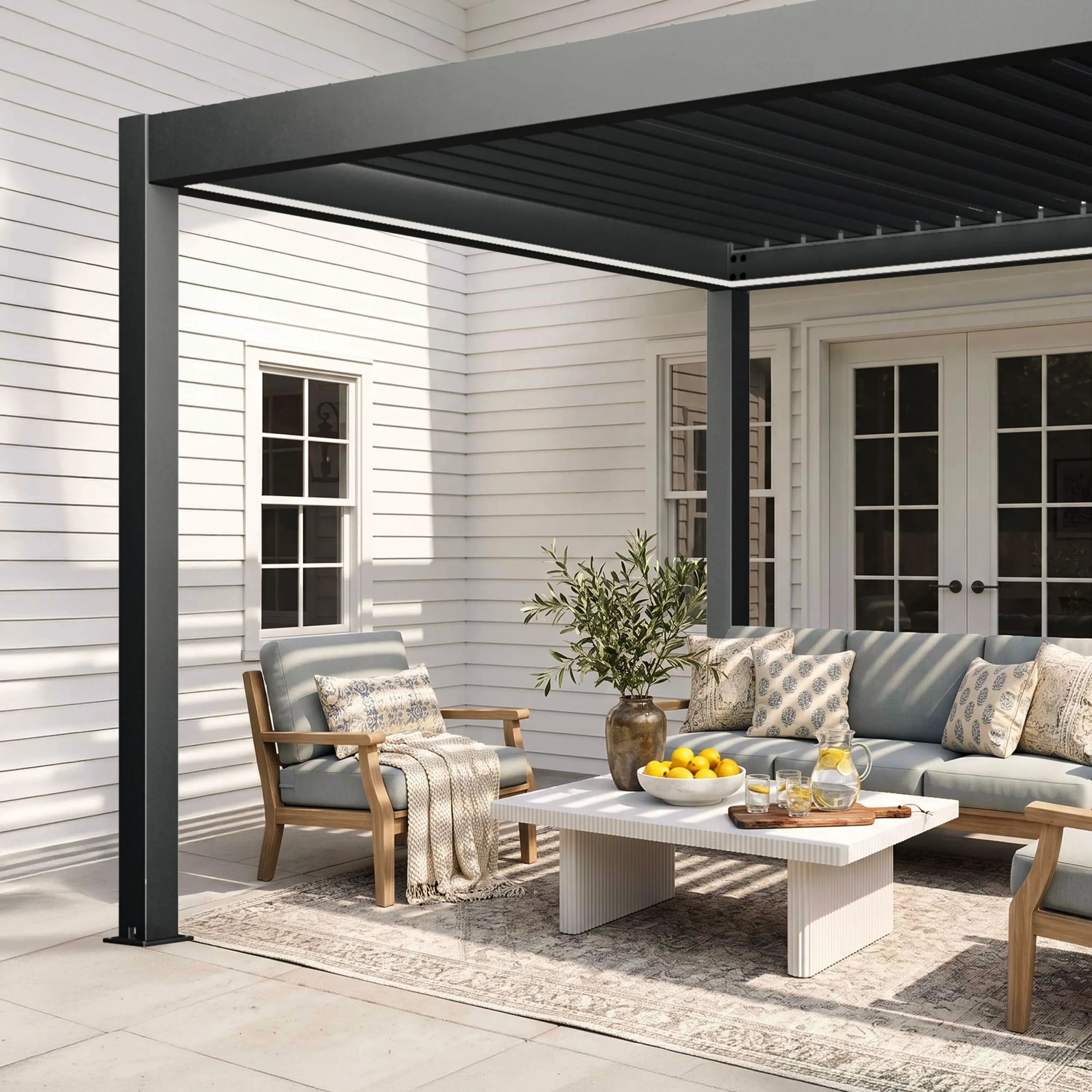 Lifestyle photo of the Aleko Noble motorized pergola on a patio
