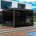 ALEKO pull down privacy screen installed on the side of an aluminum pergola