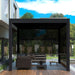ALEKO Noble 10x12 aluminum pergola on a patio, shown with the pull down privacy screen