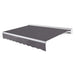 Awntech Destin motorized retractable awning in Gunmetal acrylic fabric, extended, three-quarter view with white aluminum hood and wave valance